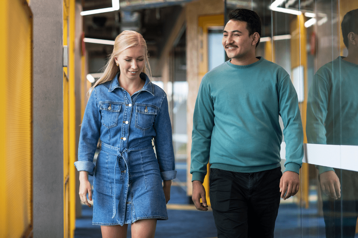 A male and female student walking together