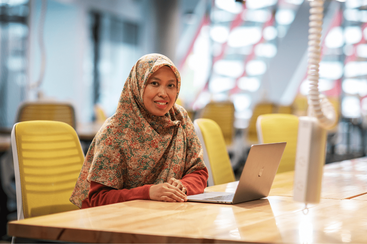 A female student using a laptop