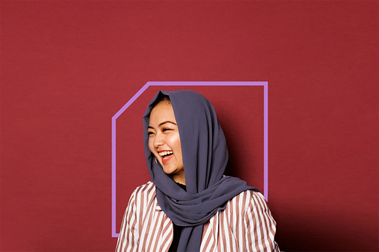 Female student on campus outdoors with a black top 