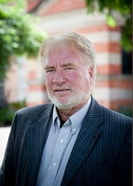 Associate Professor Hart Cohen with trees and the Female Orphan School in the background.