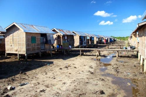 Huts on dried water bed